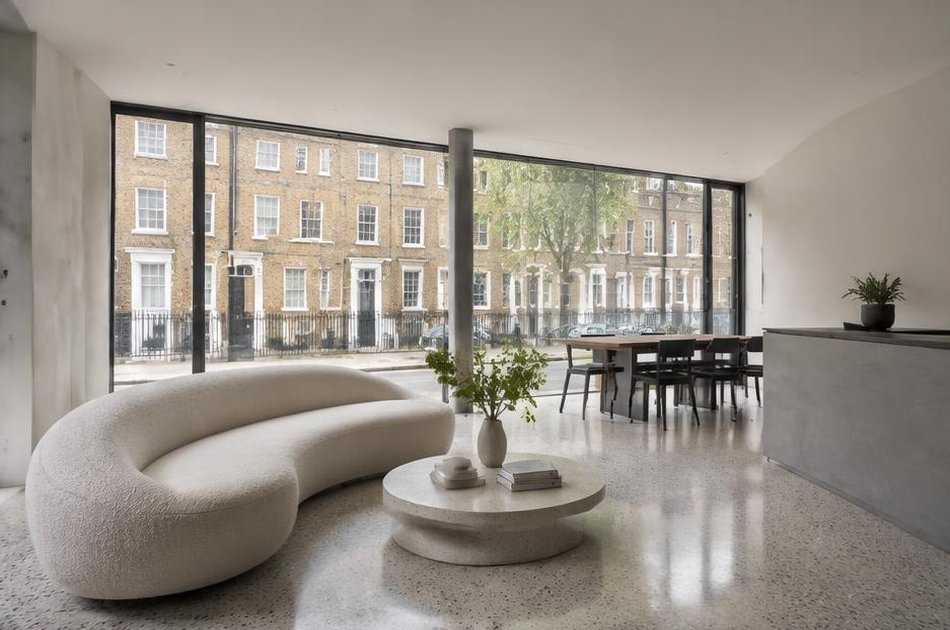 Pared-back refurbished interior with broad glazing in Angel