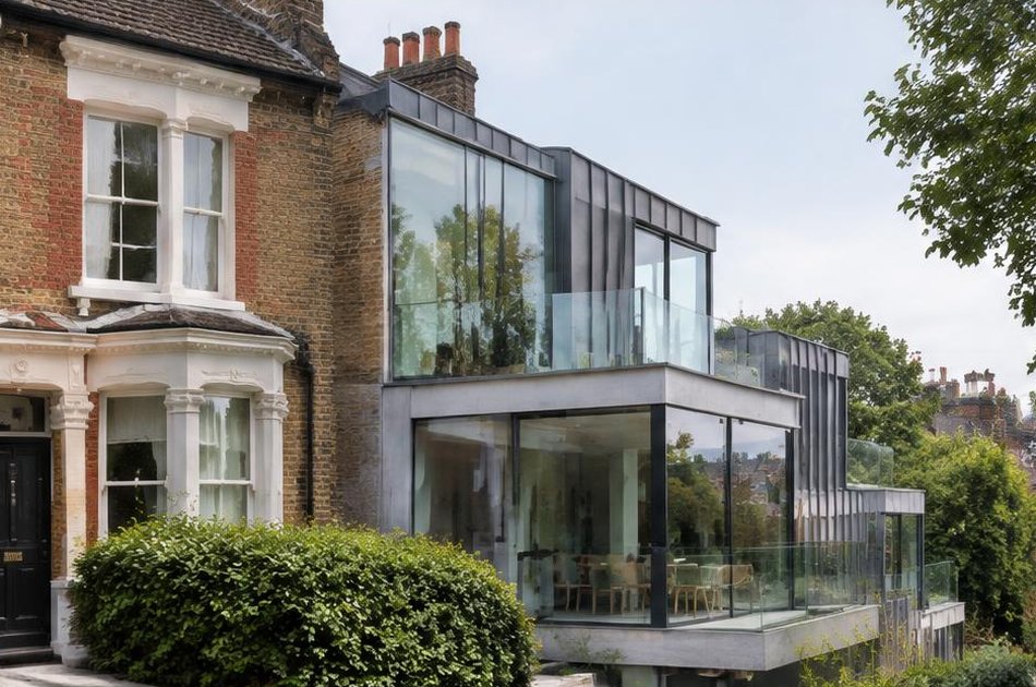 Retained historic facade beside a bold contemporary addition in Archway