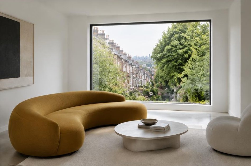 Pared-back refurbished interior with broad glazing in Archway