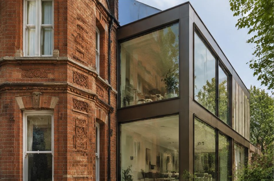 Retained period facade beside a prominent contemporary glazed addition in Balham