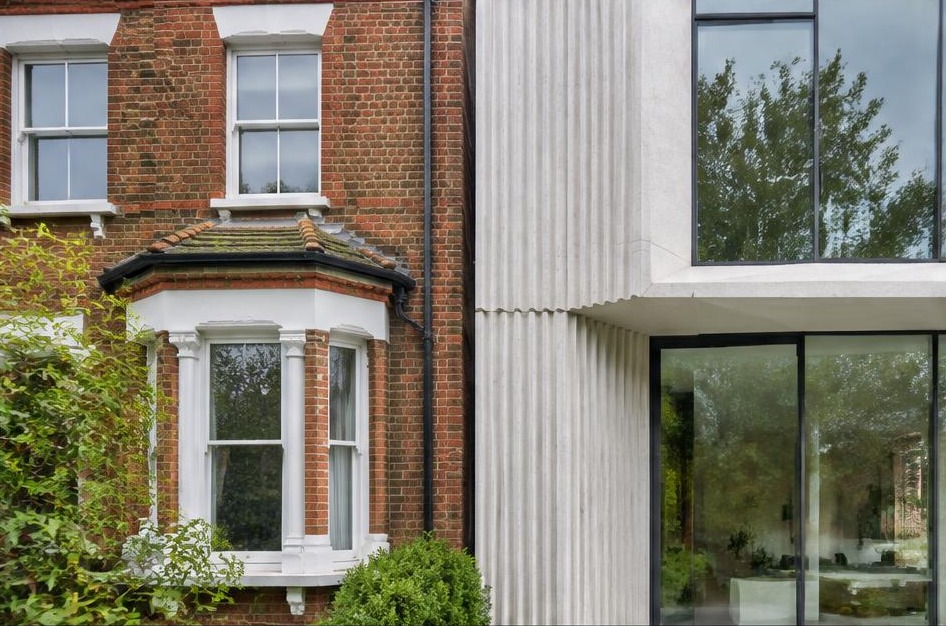 Retained historic facade meeting a bold contemporary residential addition in Barnes