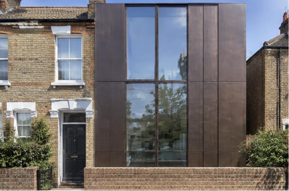 Retained period facade beside a prominent contemporary glazed addition in Balham