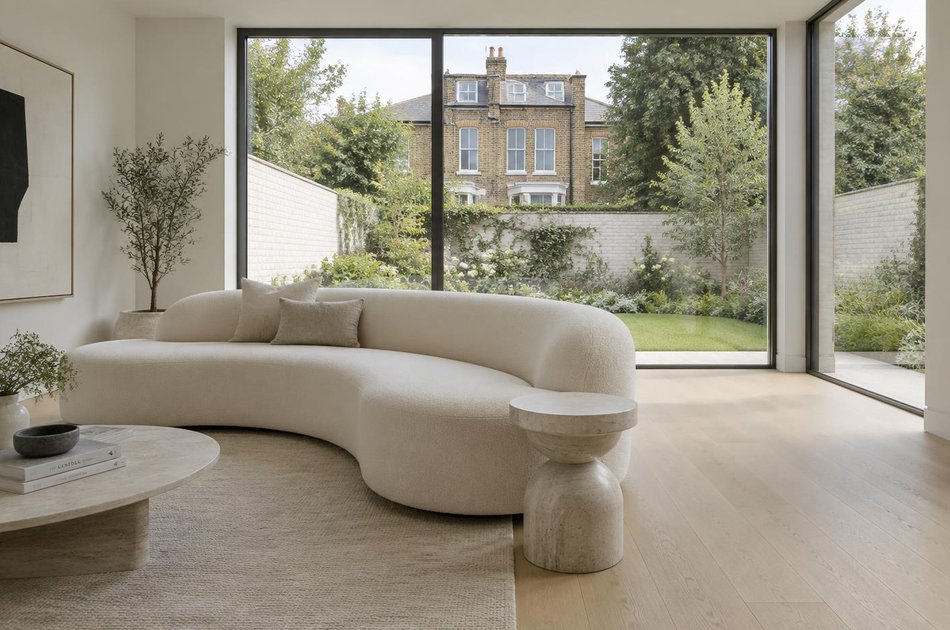 Contemporary living space opening onto a garden in Beckenham