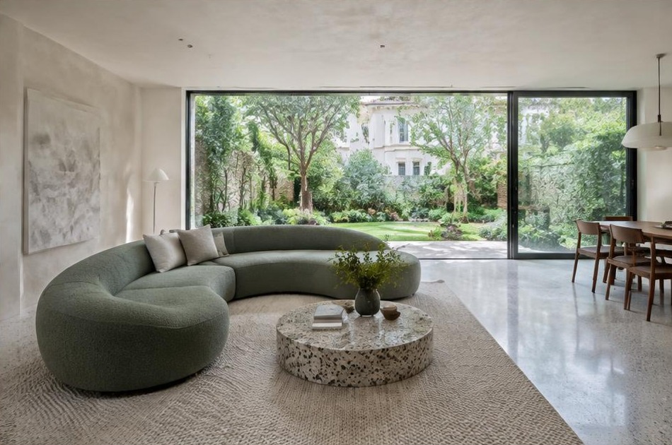 Contemporary refurbished interior with broad garden glazing in Belsize Park