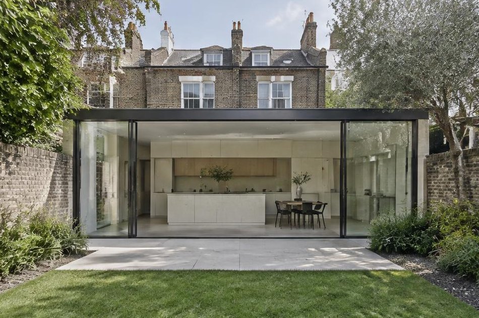 Glass-box kitchen extension onto a walled garden in Blackheath