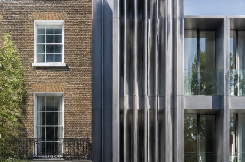 Retained historic facade beside a dominant contemporary glazed addition in Bloomsbury