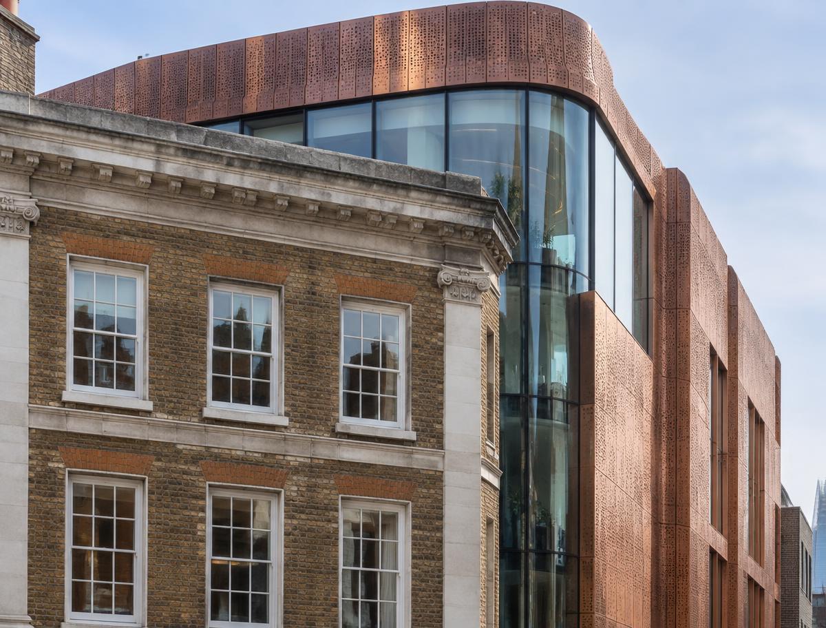 Retained historic facade directly beside a contemporary glazed residential addition in Borough