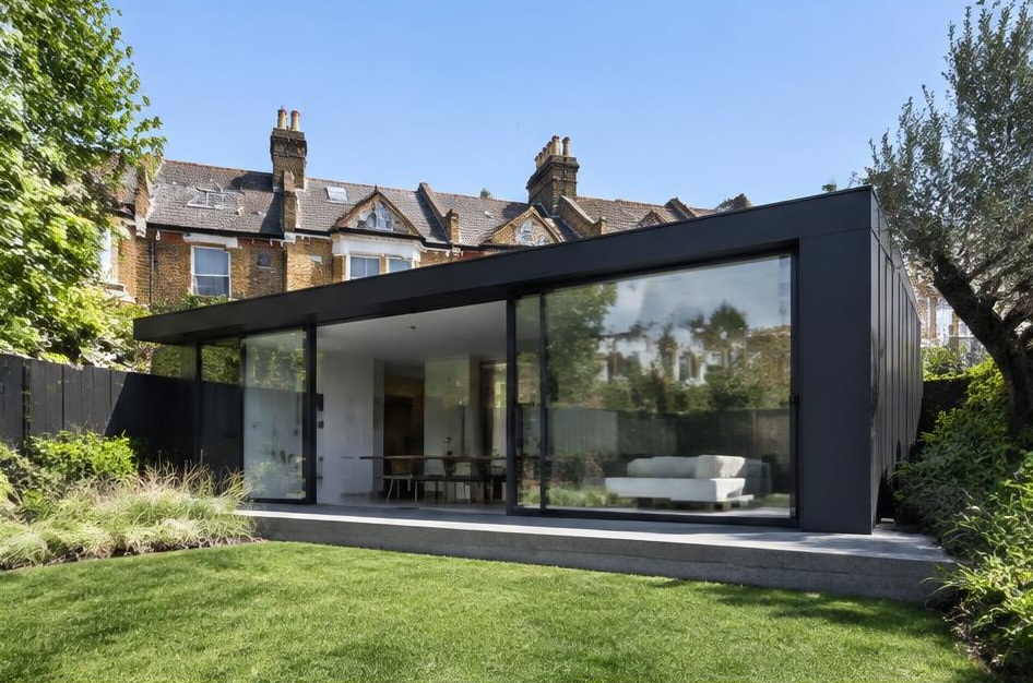 Contemporary glazed garden extension behind a period home in Brackenbury Village