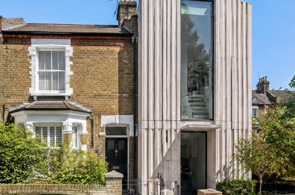 Retained period facade beside a prominent contemporary glazed addition in Brackenbury Village