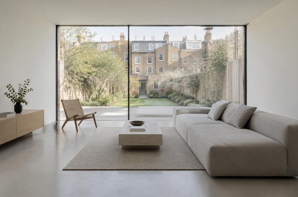 Contemporary living space opening onto a garden in Brent