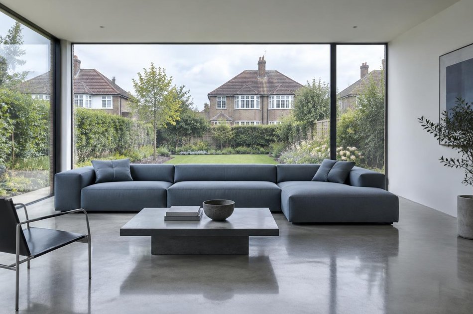 Contemporary living space opening onto a garden in Bromley Town