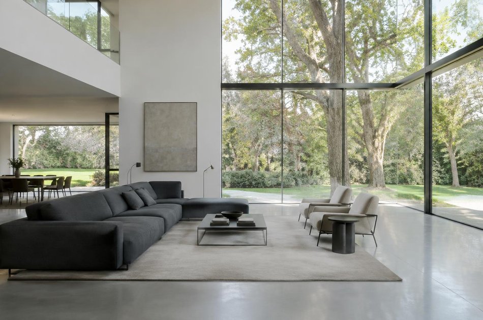 Contemporary living space opening onto a garden in Brondesbury
