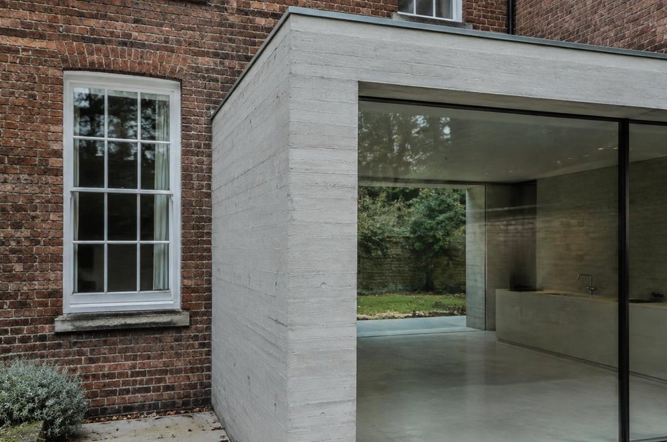 Georgian facade beside a concrete rear extension in Bruce Grove