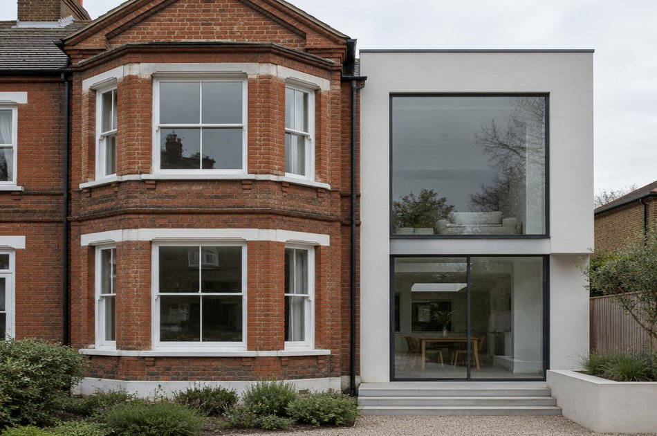 Period facade beside a new contemporary extension in Bush Hill Park