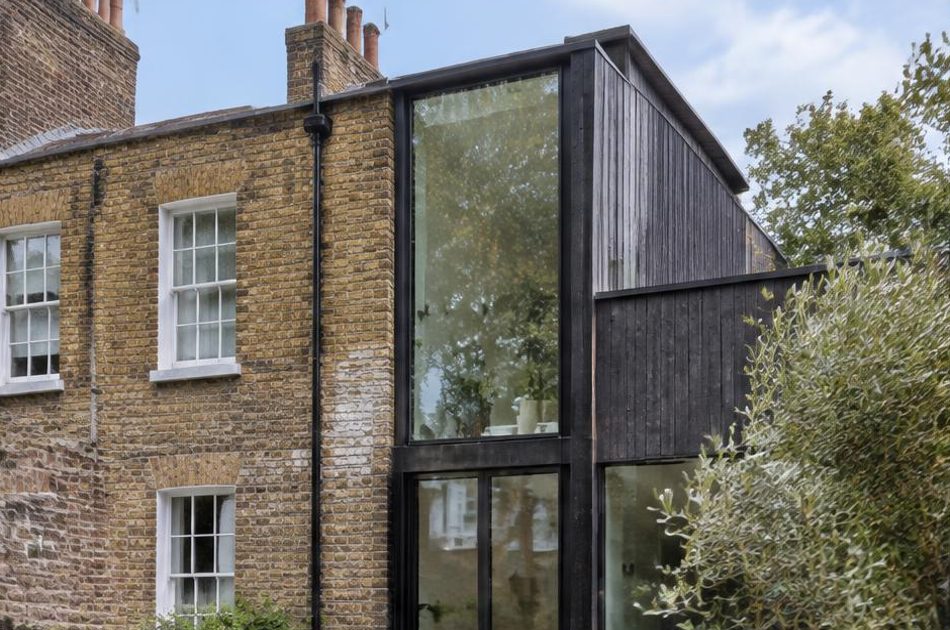 Retained historic facade directly beside a contemporary glazed residential addition in Camberwell