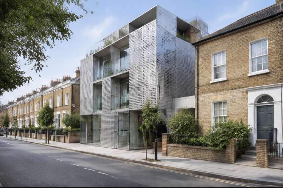Bold contemporary architecture beside local residential buildings in Camden