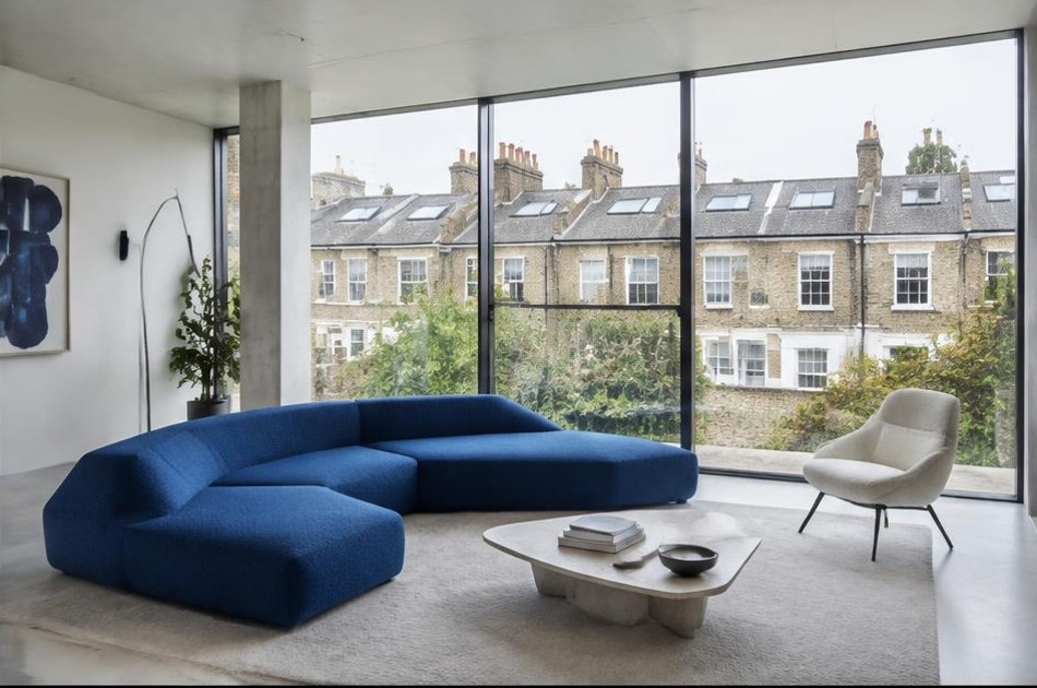 Minimalist contemporary living space with local residential garden views in Camden