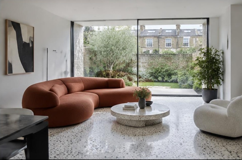 Contemporary refurbished interior with broad garden glazing in Camden