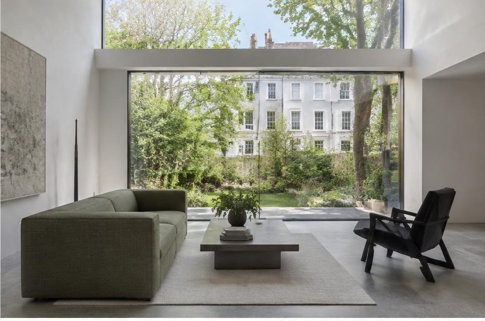 Minimalist contemporary room with straight fabric seating and views onto Clapham residential homes and gardens
