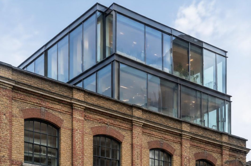 Retained historic facade beside a bold contemporary addition in Clerkenwell
