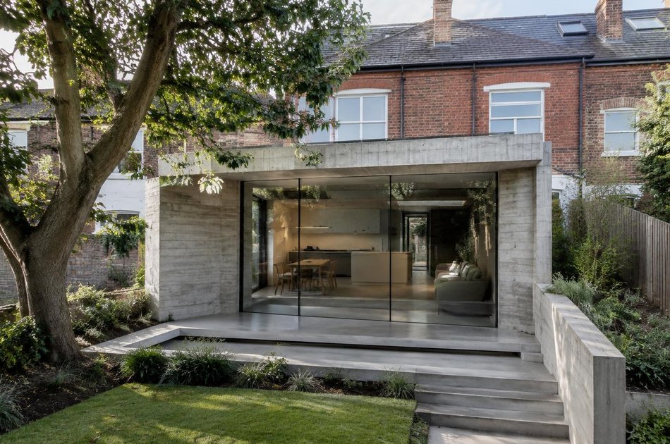 Concrete garden extension beside a mature tree in Crouch End