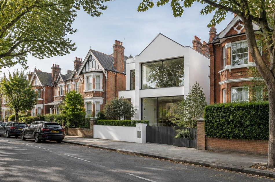 White contemporary villa on a tree-lined street in Crouch End