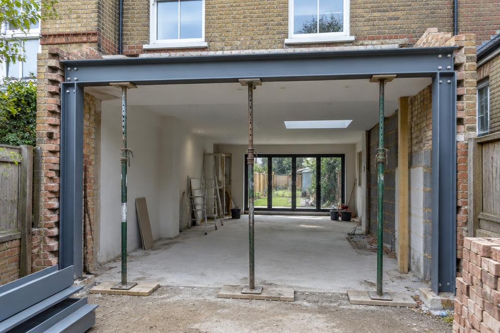 Steel goalpost being installed for an open-plan rear extension