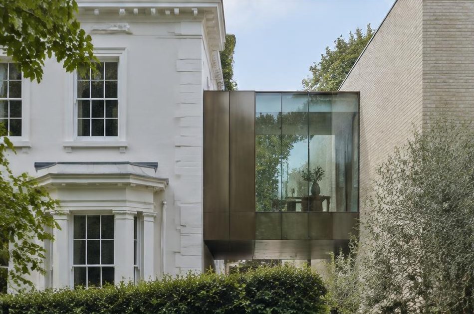 Retained historic facade directly beside a contemporary glazed residential addition in Dulwich