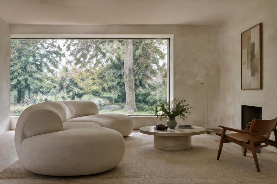 Minimalist contemporary room with straight fabric seating and views onto Dulwich residential homes and gardens