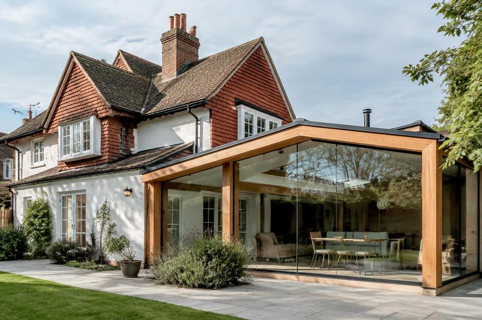 Garden-estate cottage beside an oak-framed glass extension in Ealing