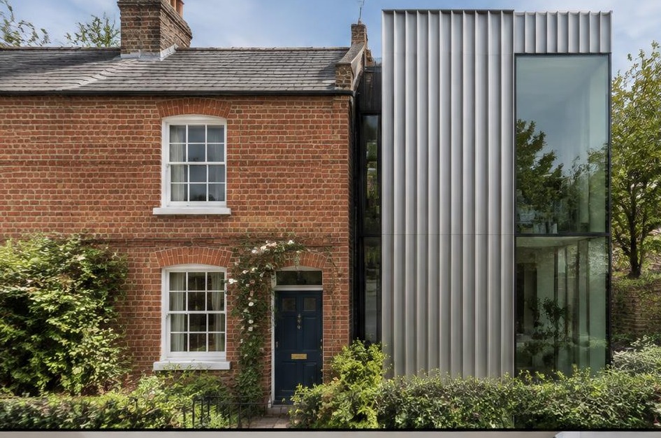Retained historic facade meeting a bold contemporary residential addition in East Sheen