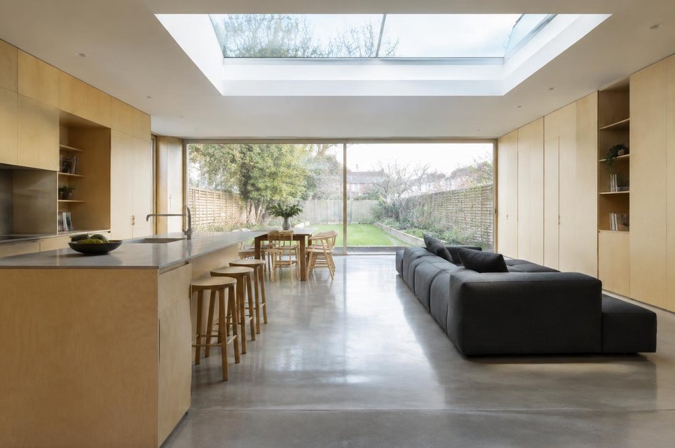 Contemporary living space opening onto a garden in Elm Park
