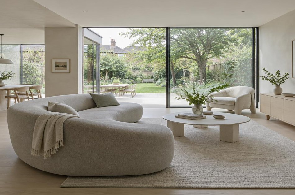 Contemporary living space opening onto a garden in Enfield