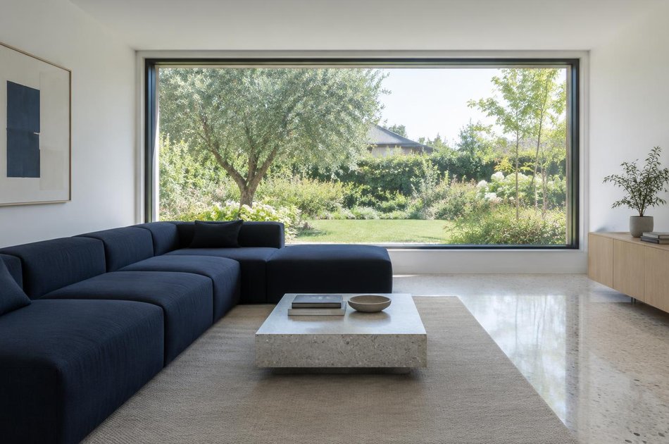 Contemporary living space opening onto a garden in Feltham