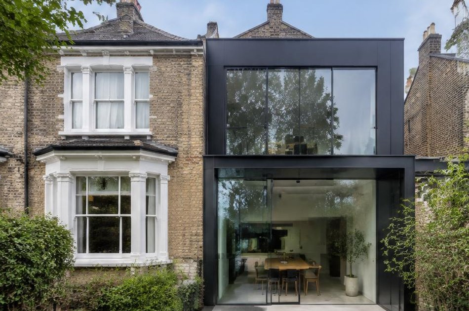 Retained historic facade beside a bold contemporary addition in Finsbury Park