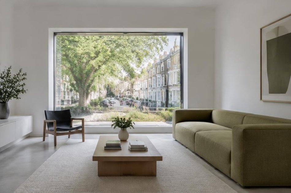 Pared-back refurbished interior with broad glazing in Finsbury Park