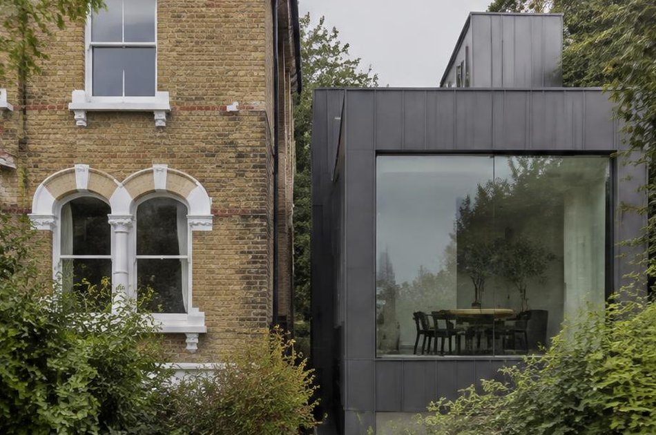Victorian villa beside a zinc-clad glazed extension in Forest Hill