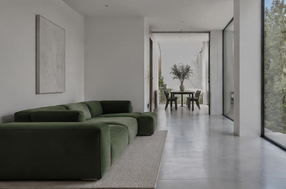 Refurbished interior with a long green sofa in Forest Hill