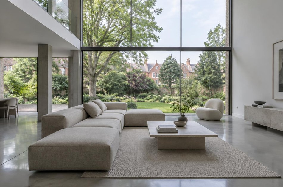 Contemporary living space opening onto a garden in Golders Green