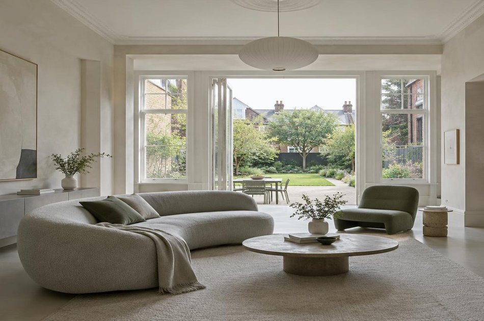 Contemporary living space opening onto a garden in Grange Park