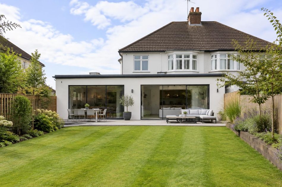 Rendered wraparound rear extension to an interwar semi in Greenford