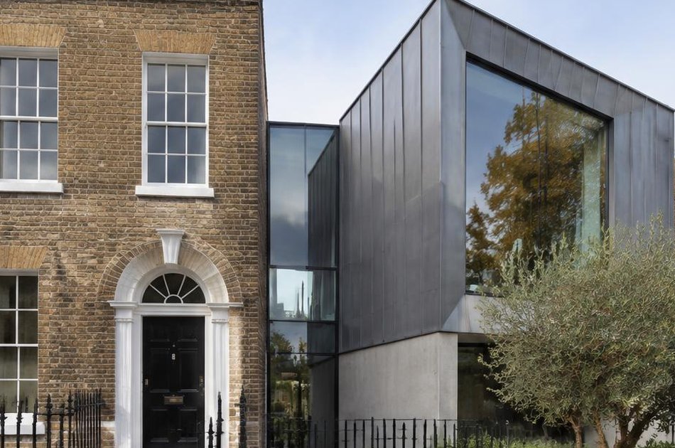 Retained Georgian brick facade beside a contemporary zinc and glass addition in Greenwich