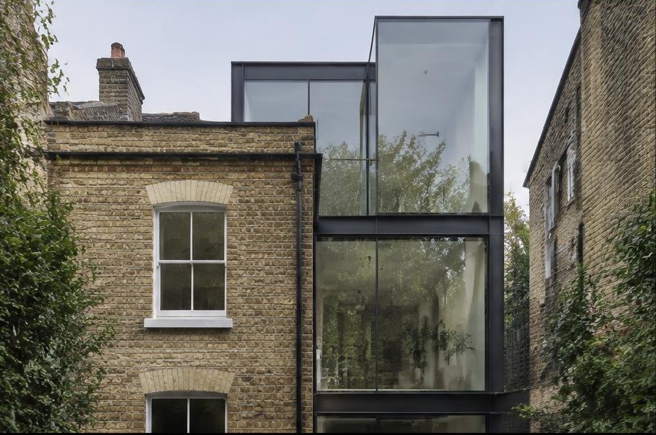 Retained original facade beside a dominant contemporary glazed addition in Hackney