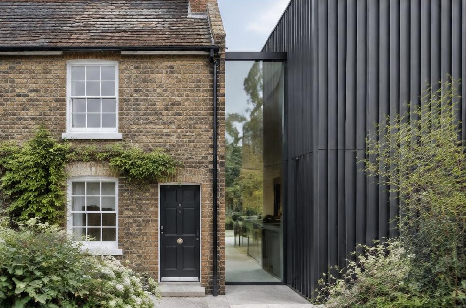 Retained historic facade meeting a bold contemporary residential addition in Ham