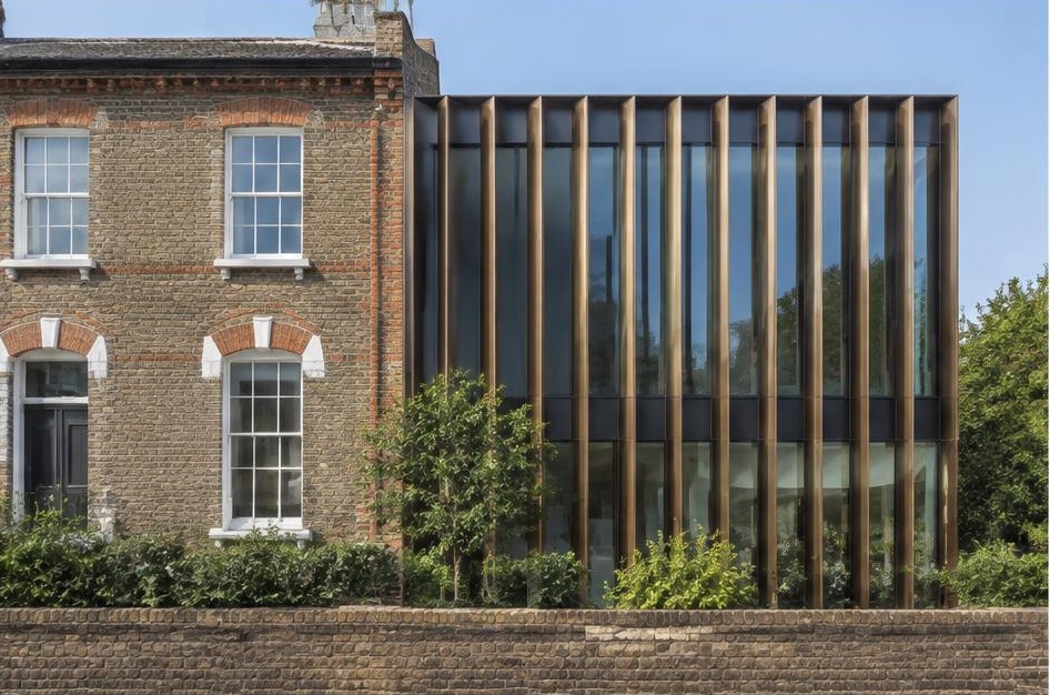 Retained period facade beside a prominent contemporary glazed addition in Balham