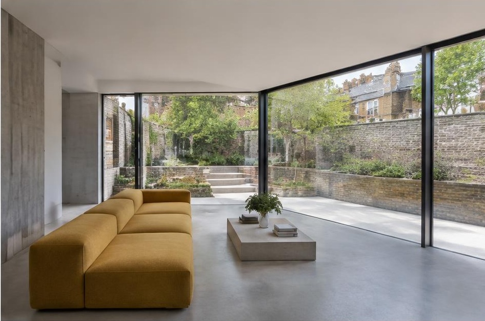 Minimalist living room with a structured fabric sofa and views of Balham homes and gardens