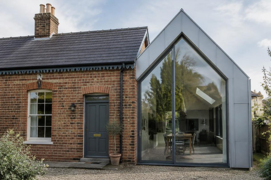 Victorian brick cottage beside a zinc and glass gabled extension in Hanwell