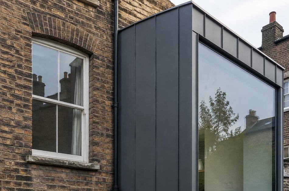 Victorian brick facade beside a zinc-clad extension in Haringey