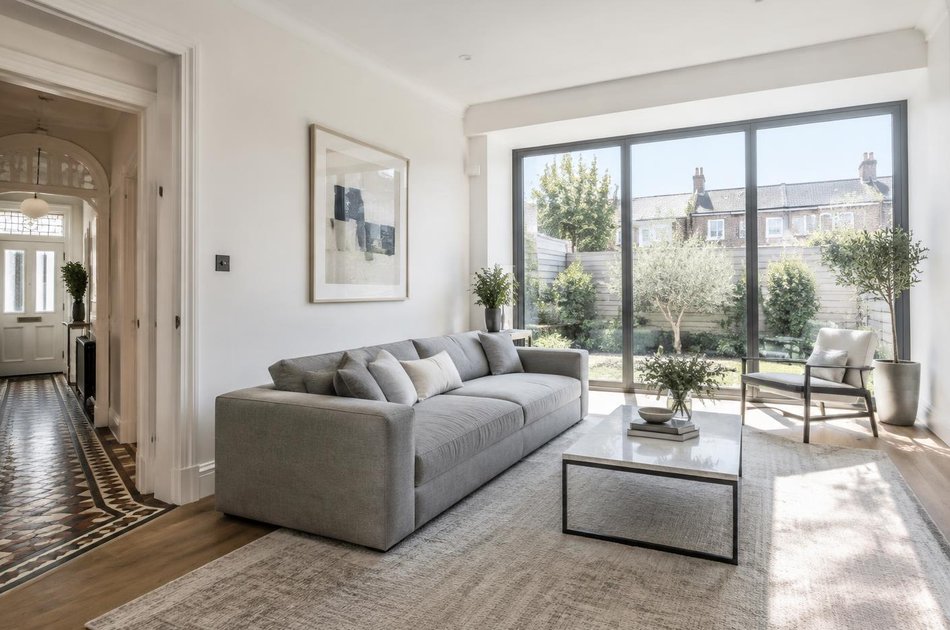 Refurbished modern interior with a retained period feature in Hatch End
