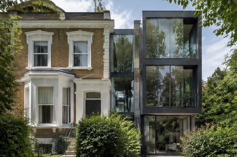 Retained historic facade beside a bold contemporary addition in Highbury